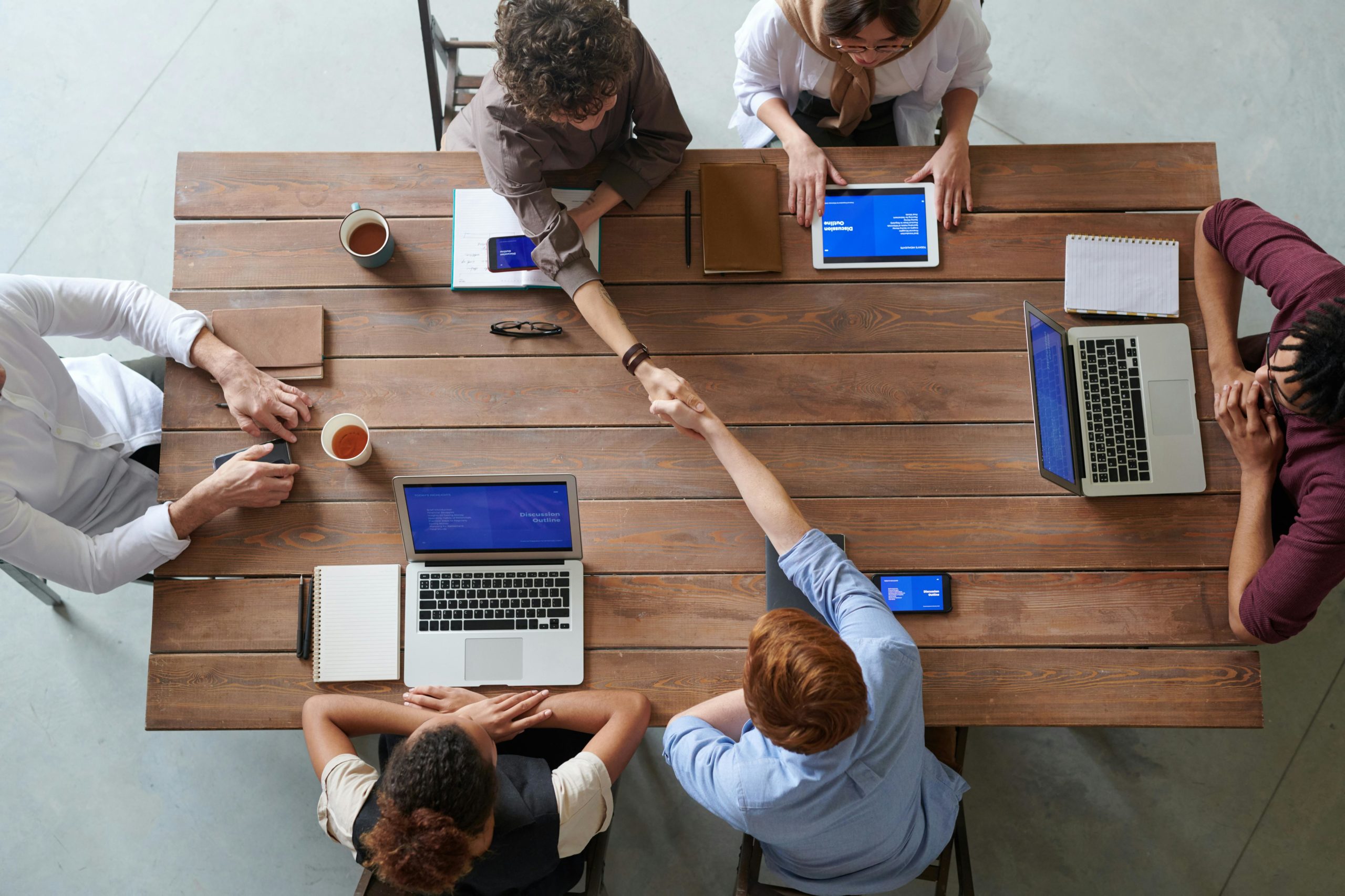 marketing teams working together at a table