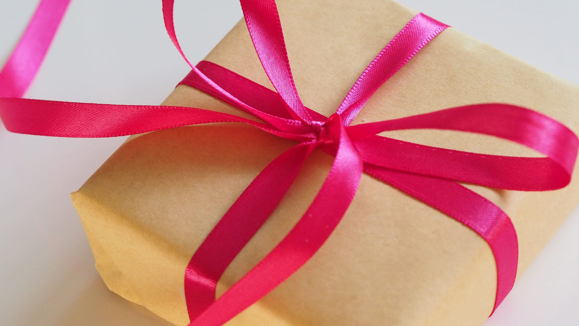 Present wrapped with pink ribbon