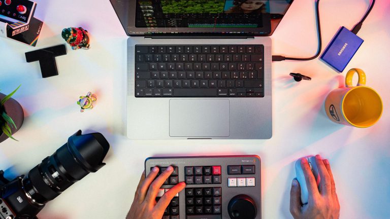 video editor working on a laptop