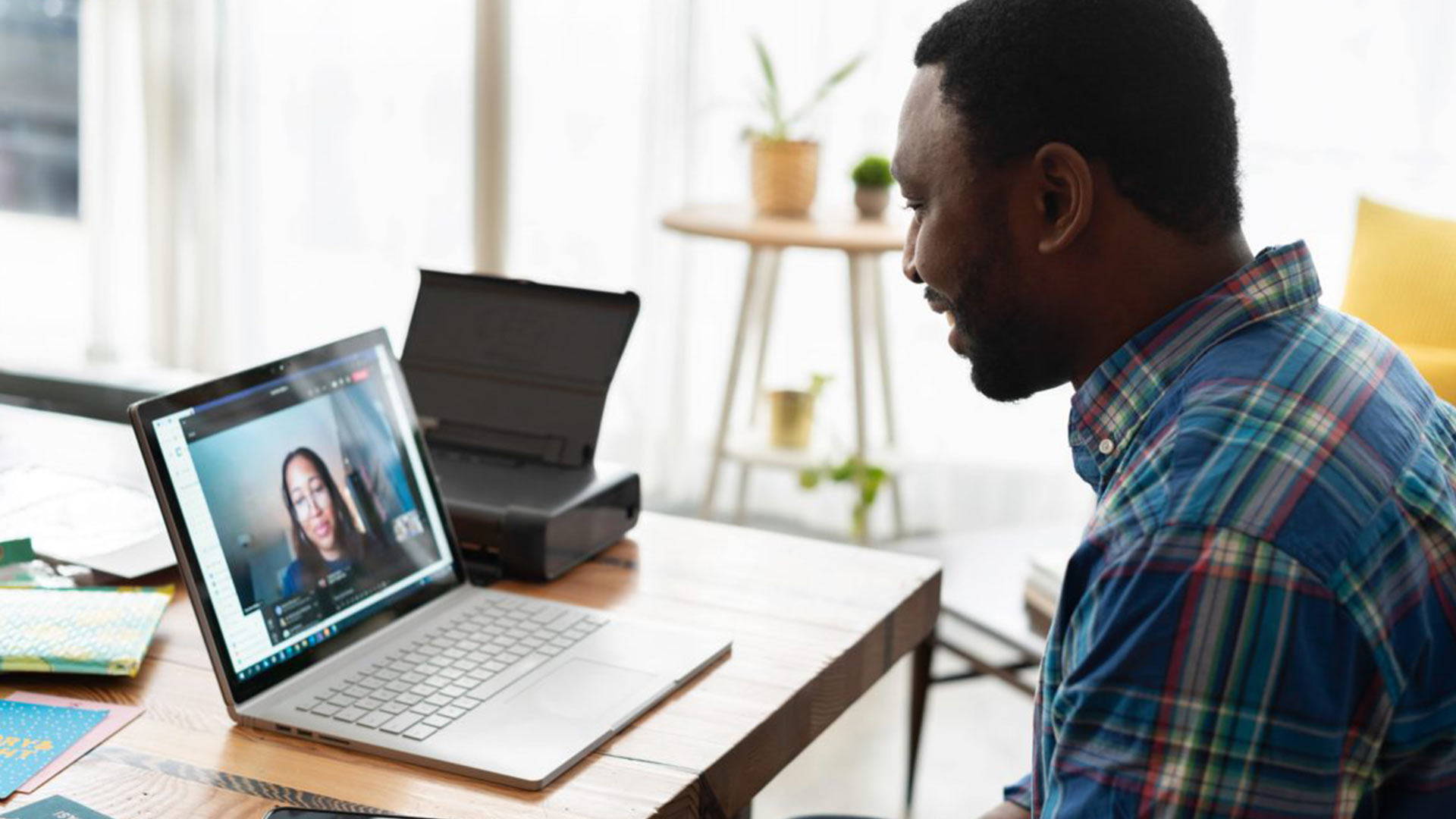 Man-on-a-video-call-on-a-laptop