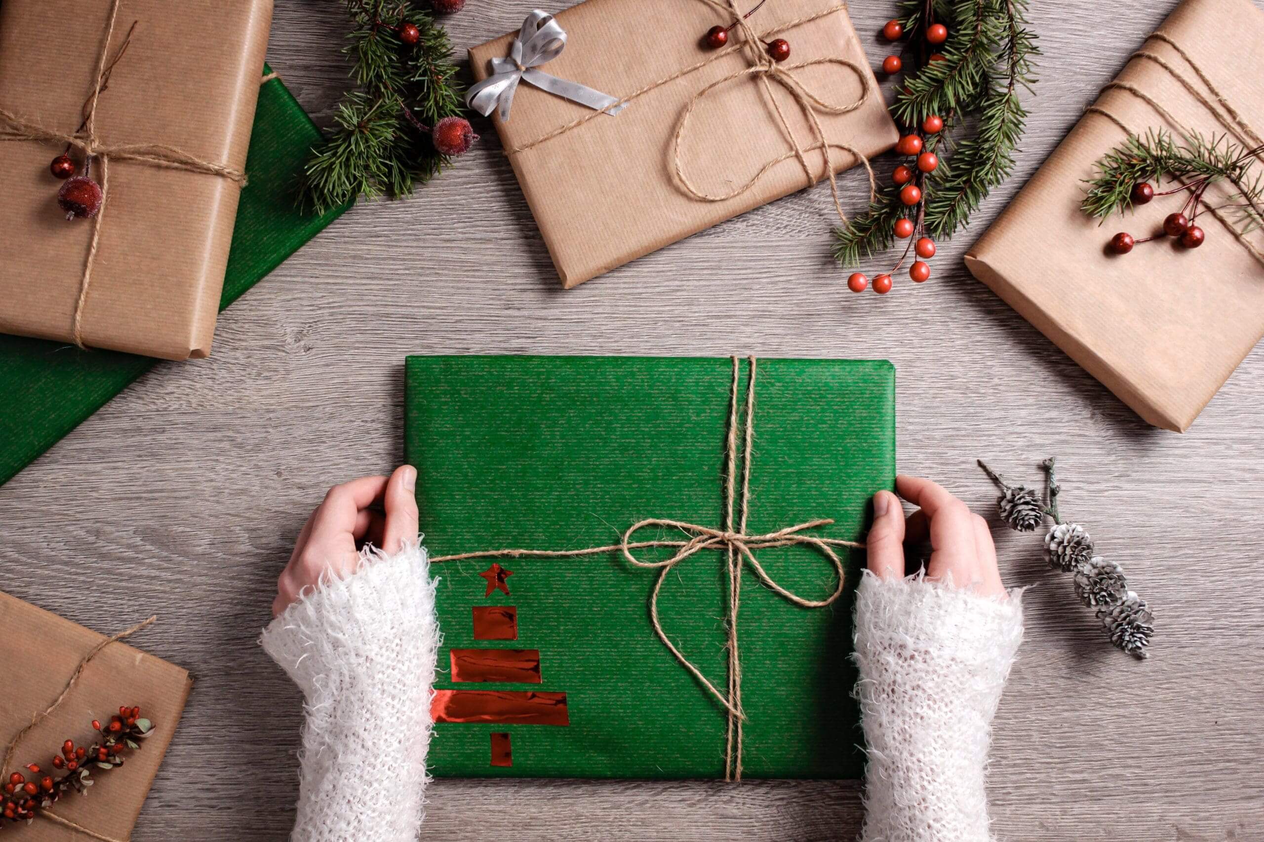 hands holding a festively wrapped gift box