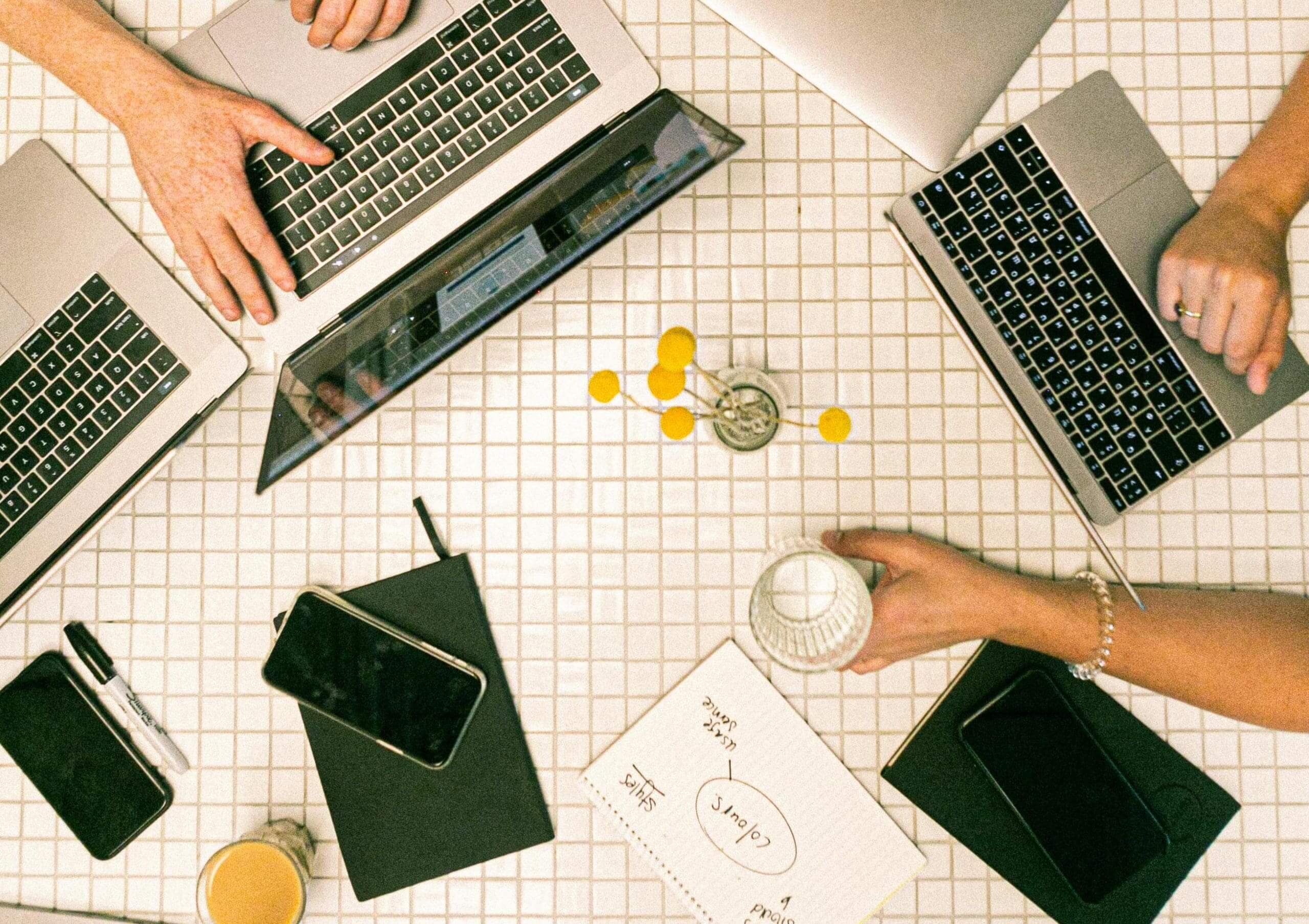 marketers planning session around laptops