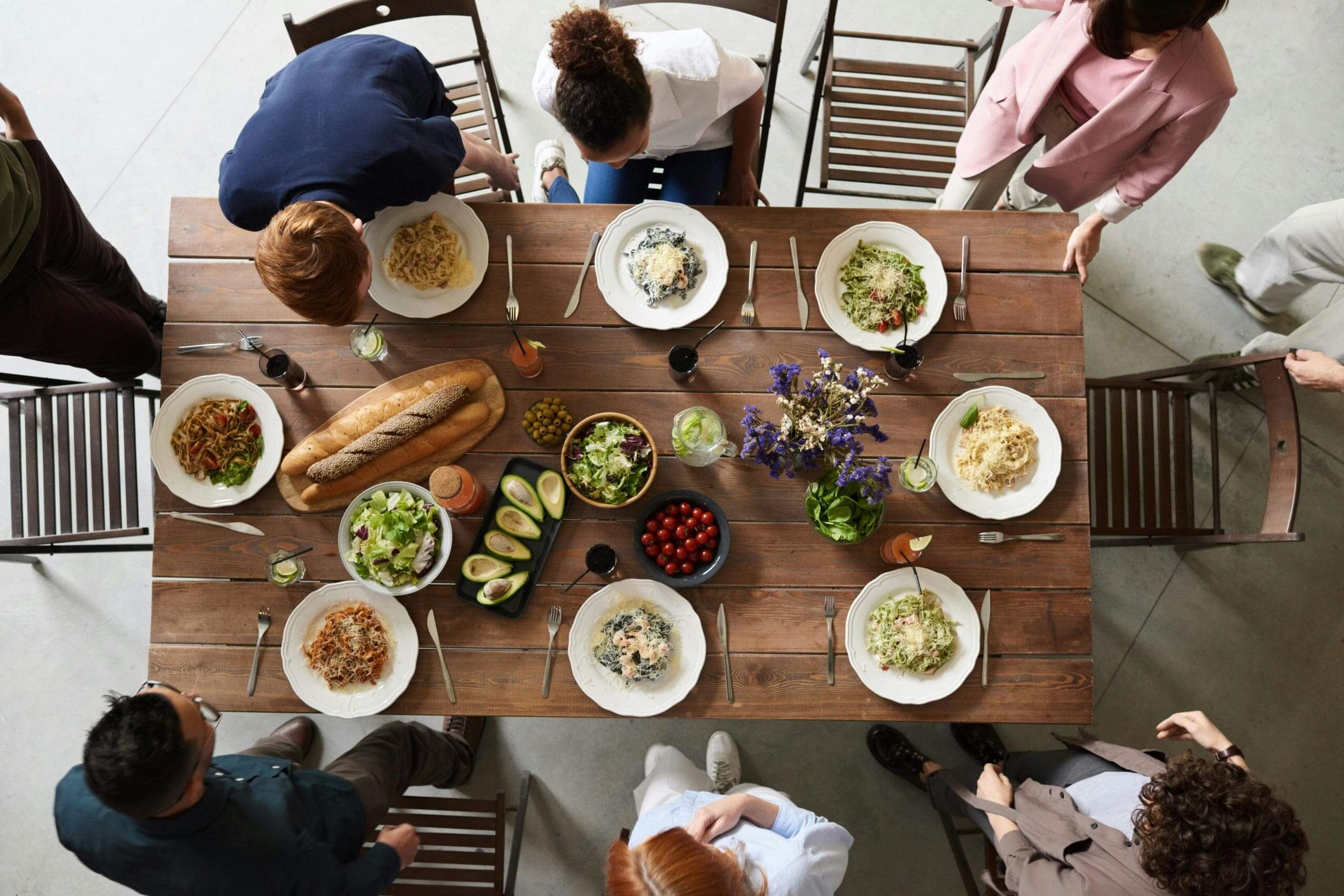 business people sitting down to a nice pasta lunch in restaurant