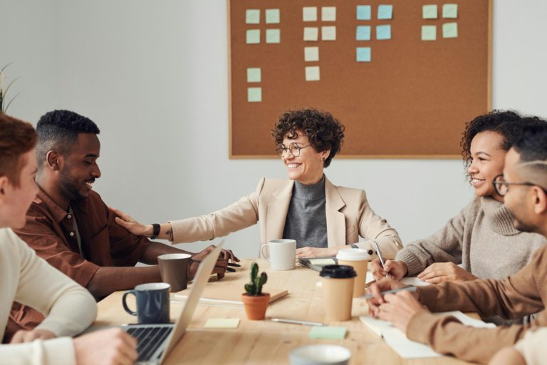 team collaborating and working together in conference room