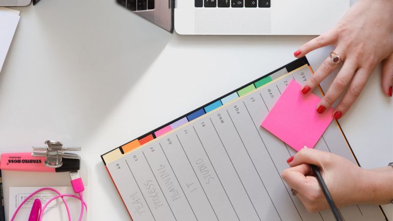 someone taking notes in their planner