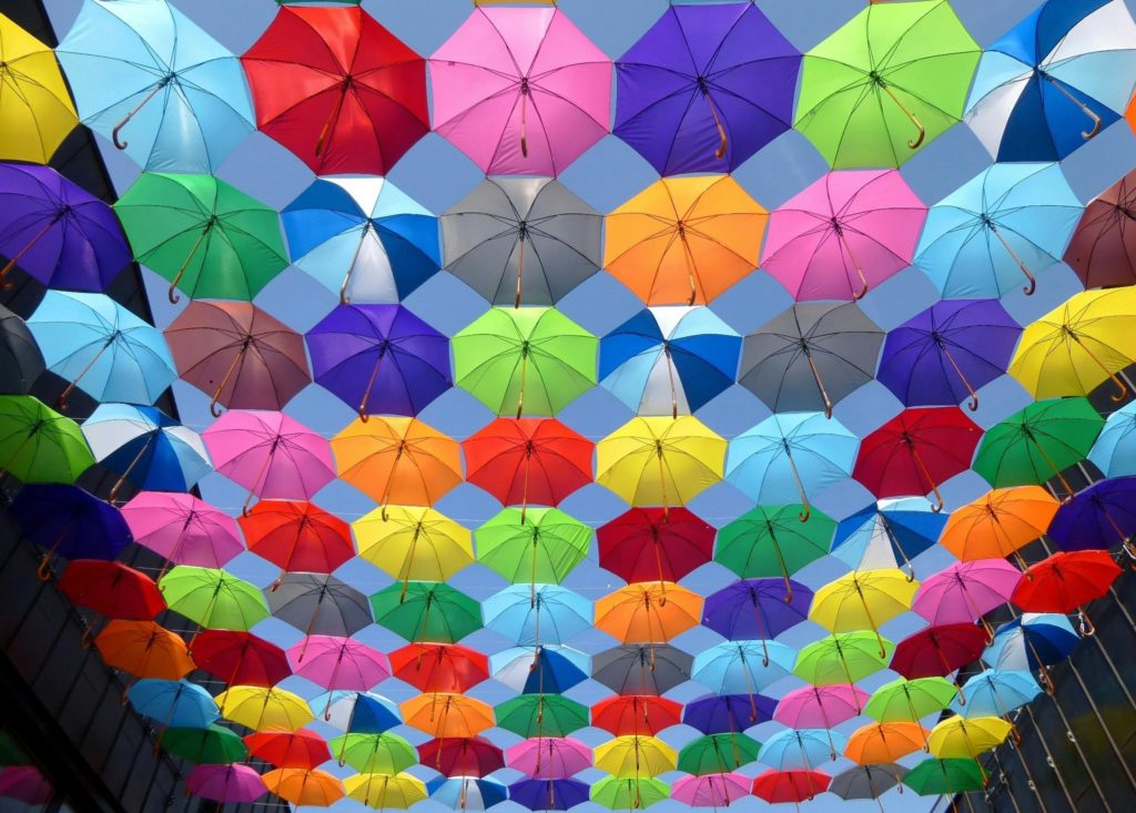 colorful eye-catching umbrellas hanging on display