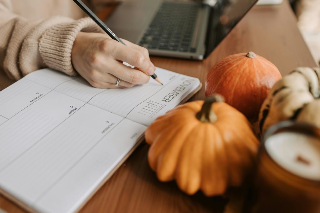 marketing planning with november calendar and pumpkin decorations