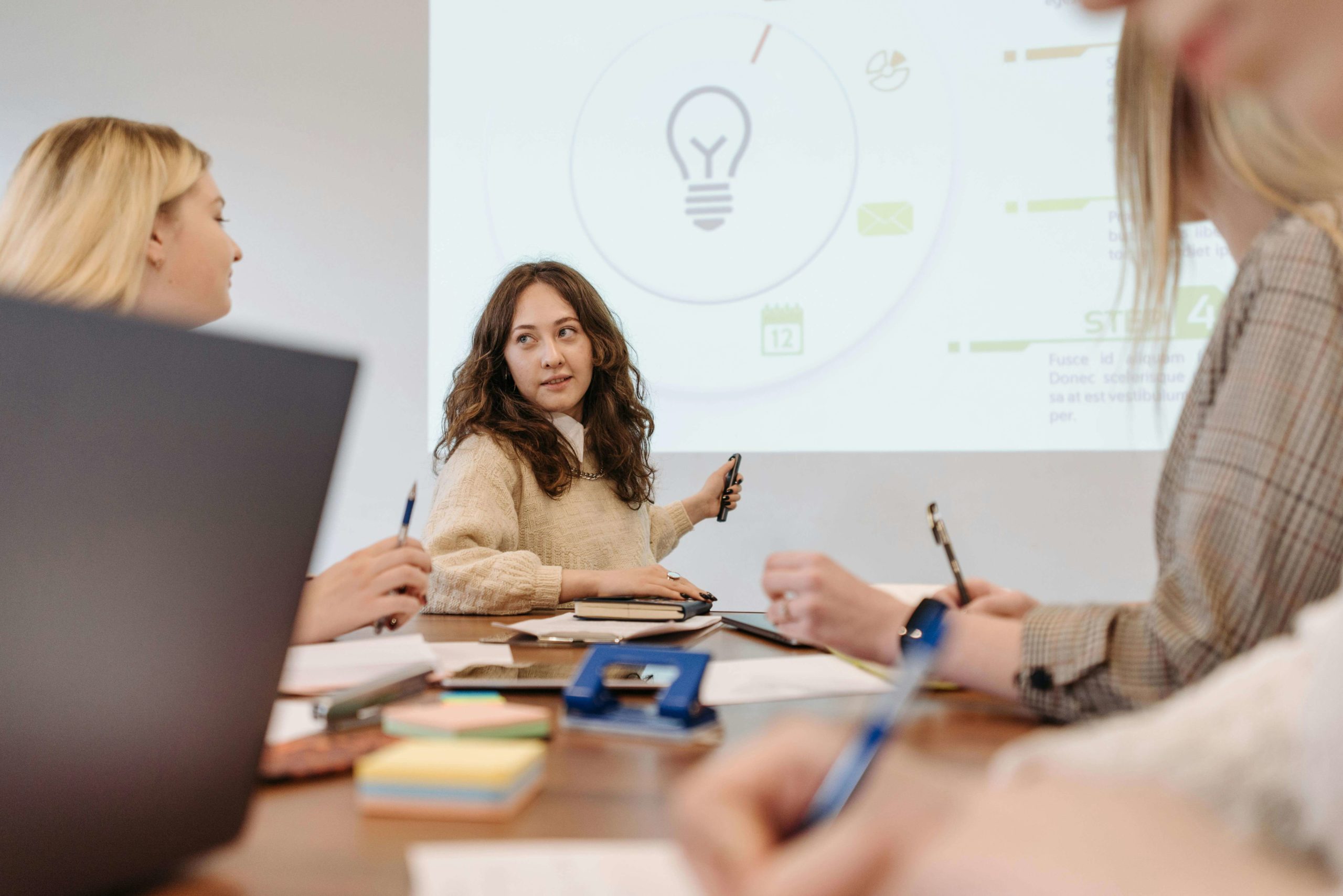 woman presenting marketing wins to team