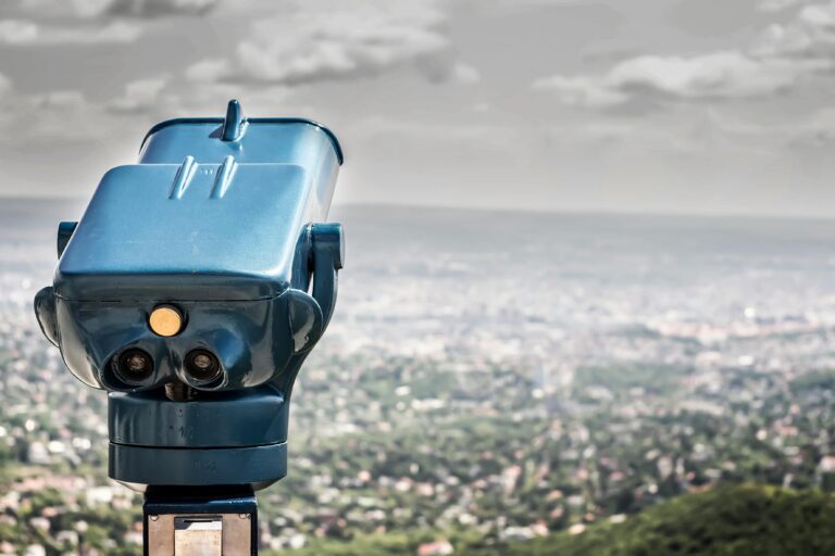 binoculars over a city