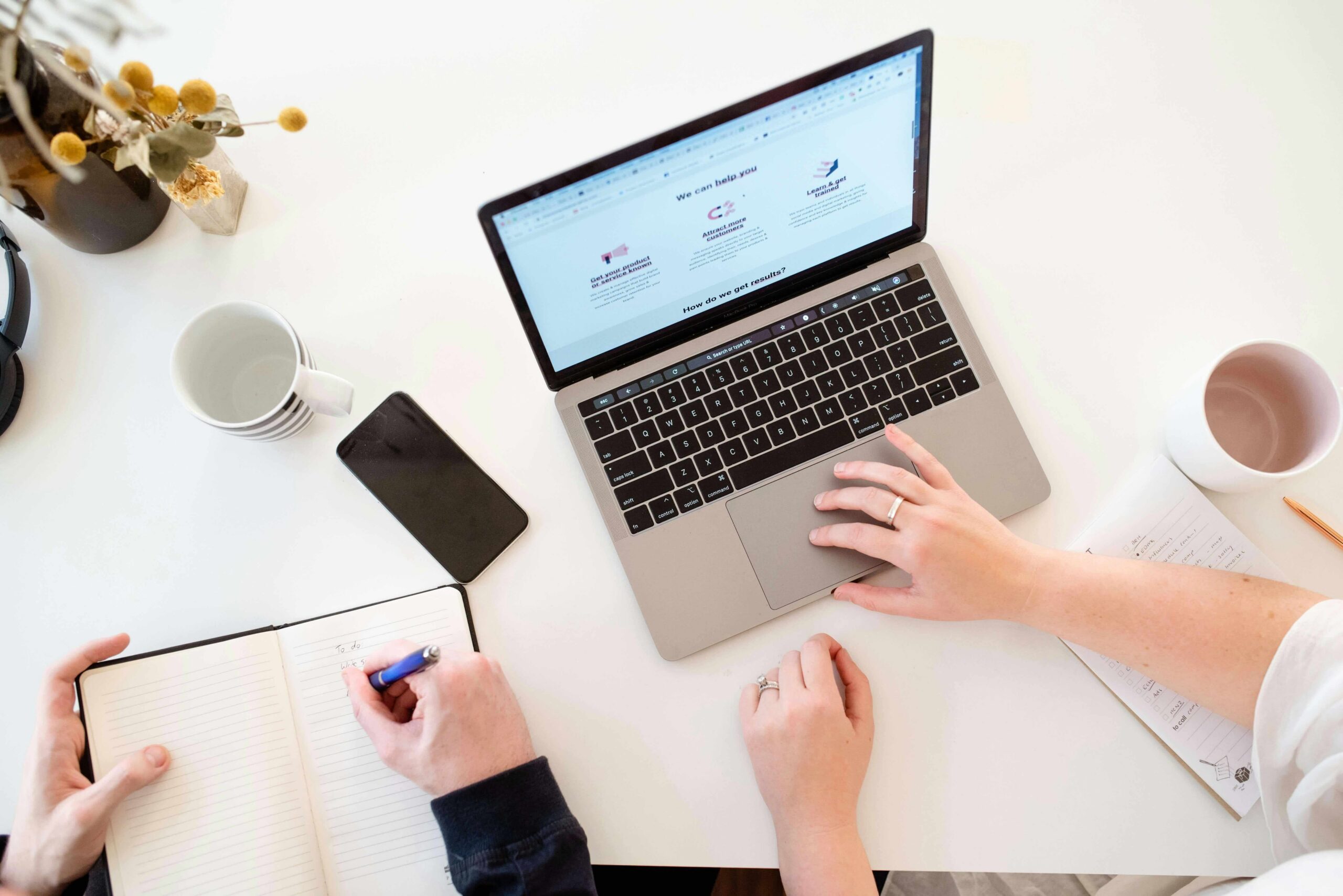 person using laptop discussing a new website