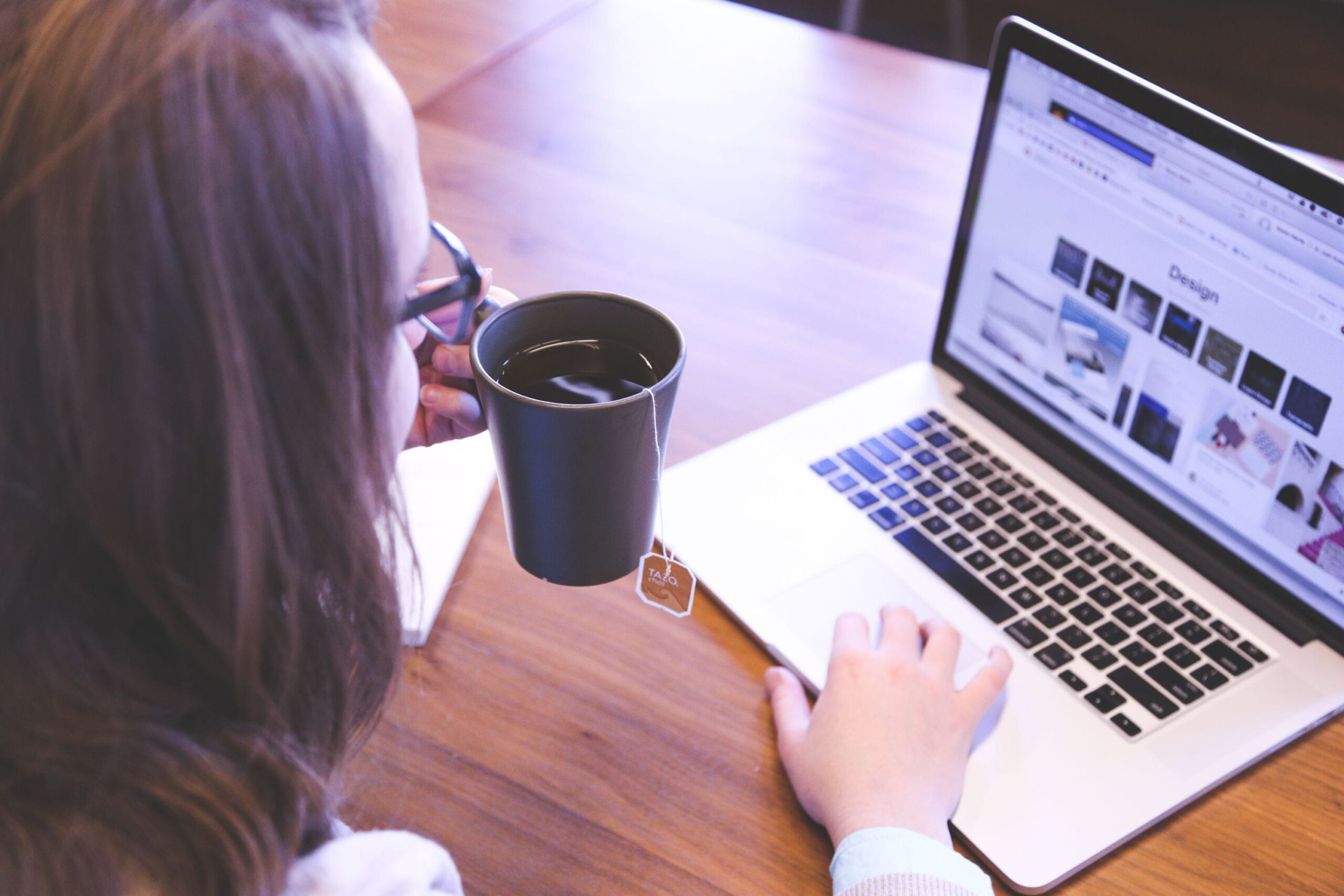 woman with coffee on her laptop